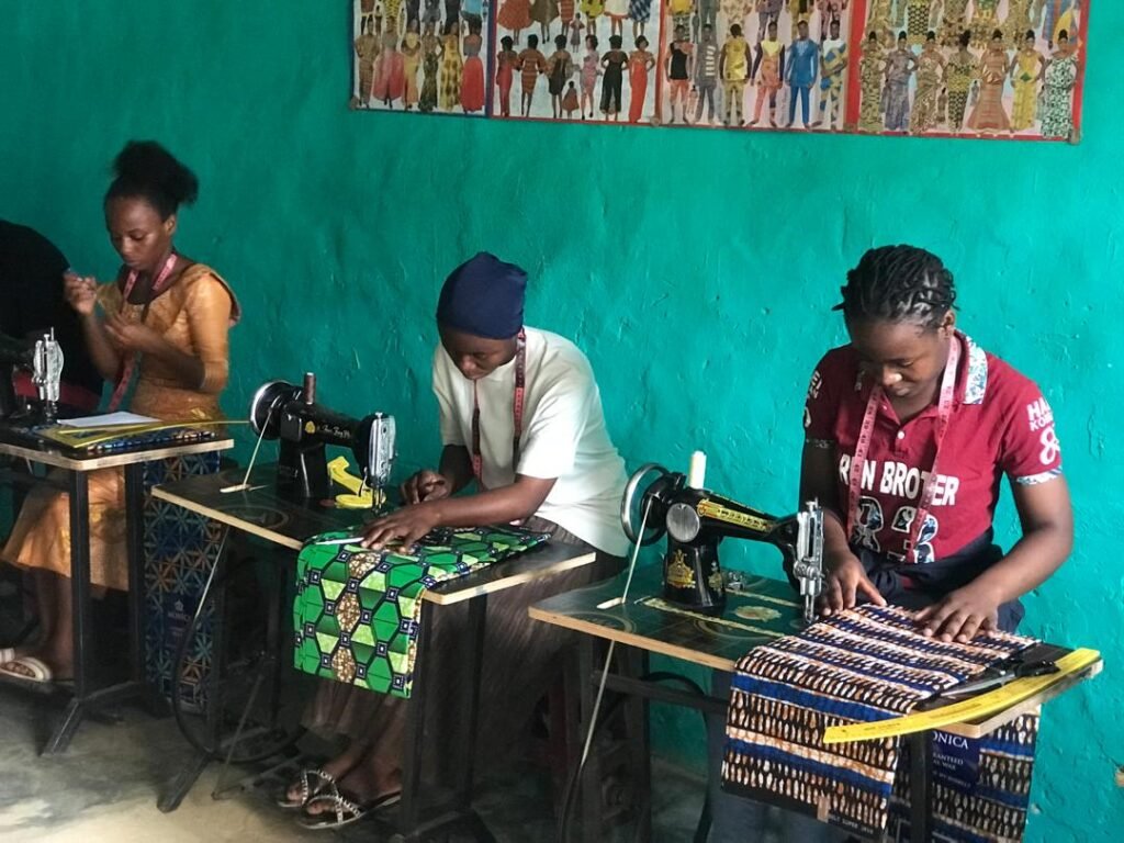women in sewing class, learning tailoring